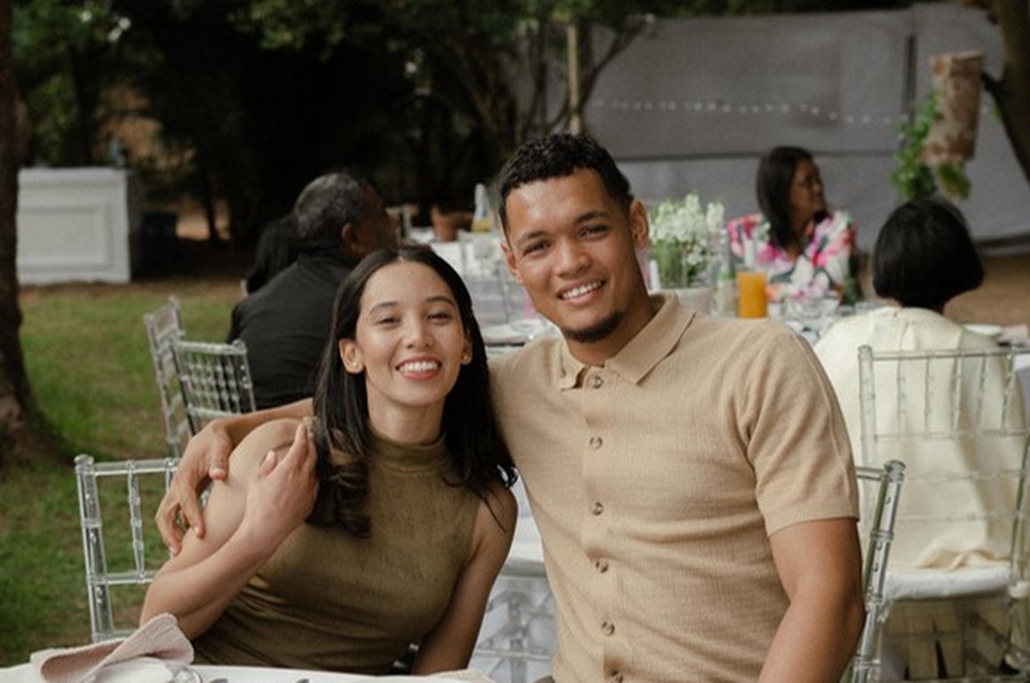 Robyn and Thomas Jacobs, founders of BrightBird, smiling together at an outdoor event